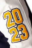 FOF WOMENS CROPPED ULTIMATE EAGLES VARSITY JACKET - NAVY/WHITE